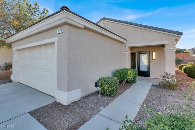 view of exterior entry featuring a garage