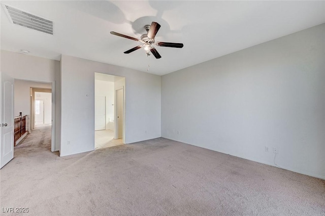 unfurnished bedroom featuring light carpet, ceiling fan, and visible vents