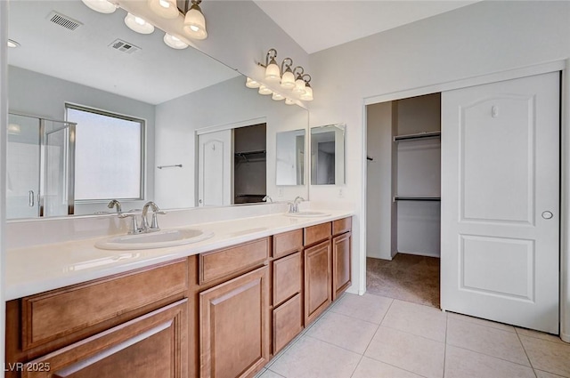 full bathroom featuring tile patterned flooring, a sink, and visible vents