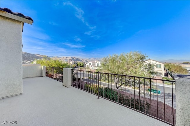 balcony with a mountain view and a residential view