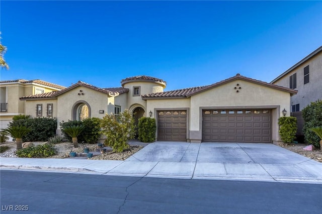 mediterranean / spanish-style house featuring a garage