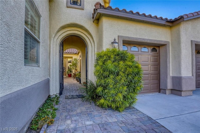 entrance to property featuring a garage