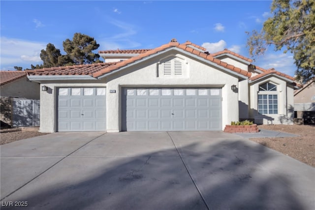 mediterranean / spanish-style home featuring a garage