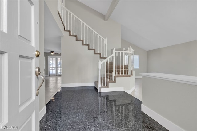 foyer entrance with ceiling fan, tile patterned floors, and french doors