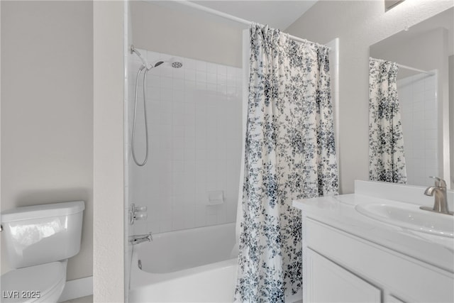 full bathroom with shower / bath combo with shower curtain, toilet, and vanity