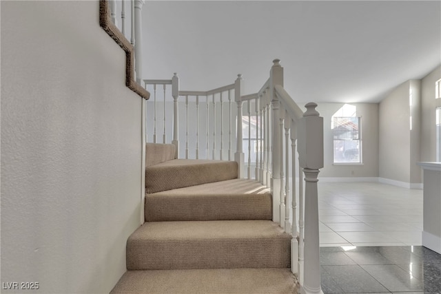 stairway featuring tile patterned floors