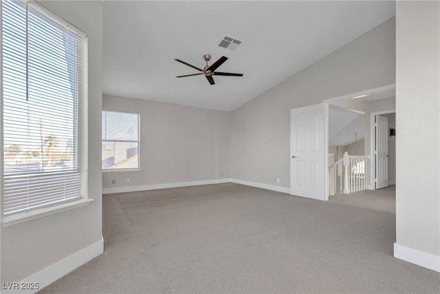 unfurnished room featuring ceiling fan, carpet floors, and lofted ceiling