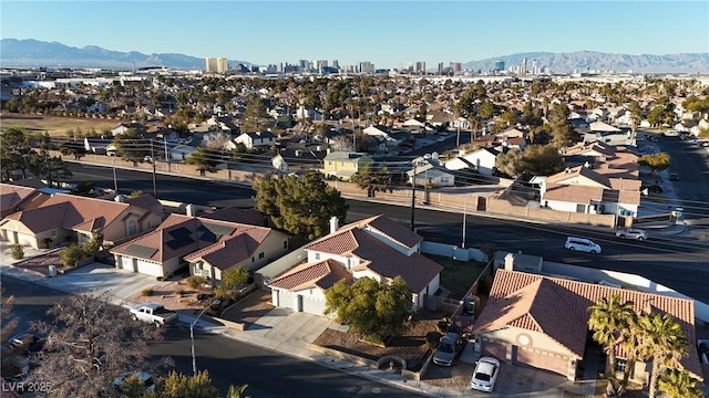 birds eye view of property featuring a mountain view