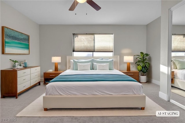 bedroom featuring light carpet and ceiling fan