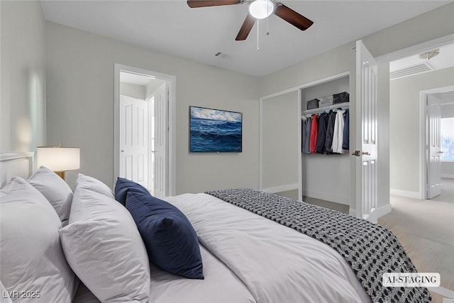 carpeted bedroom featuring a closet and ceiling fan