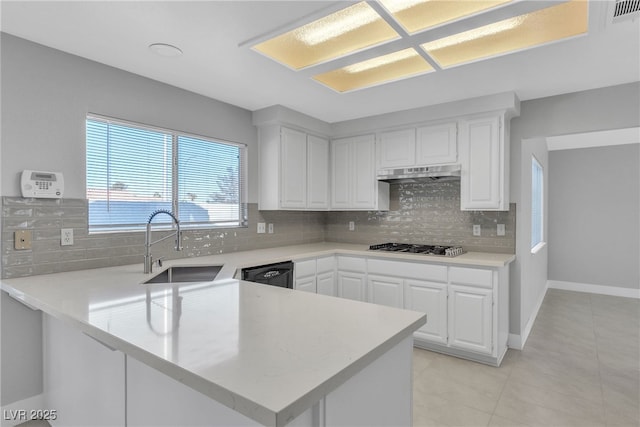 kitchen with dishwasher, white cabinetry, sink, kitchen peninsula, and light tile patterned flooring