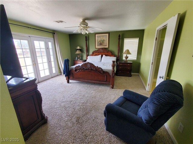 bedroom with french doors, ceiling fan, and light carpet