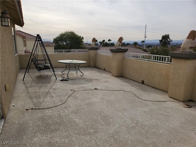 view of patio / terrace with a balcony