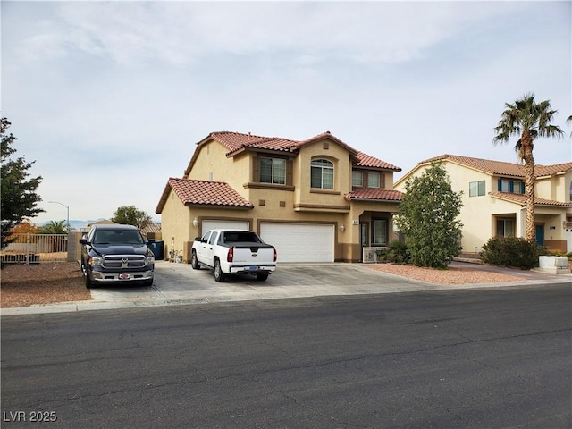 mediterranean / spanish-style home featuring a garage