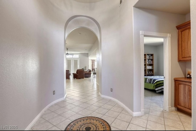 corridor with light tile patterned flooring