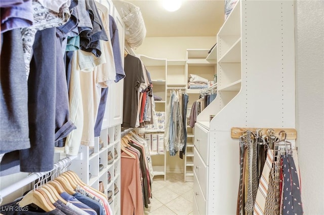 spacious closet with light tile patterned floors