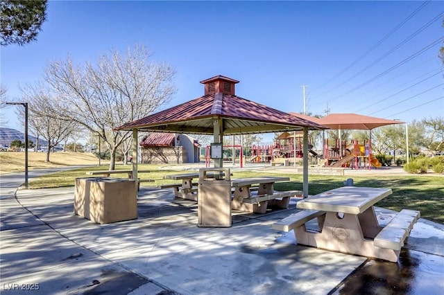 view of property's community featuring a gazebo, a playground, and a yard