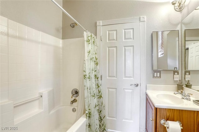 bathroom with vanity and shower / tub combo with curtain