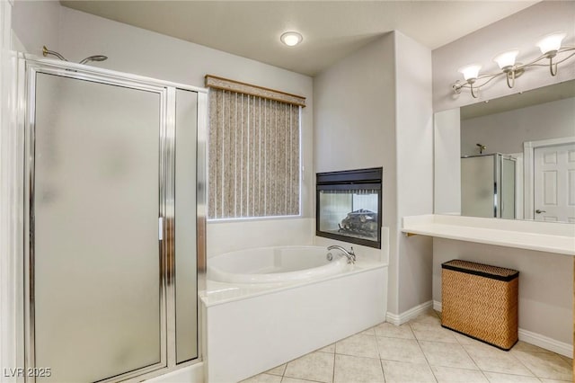 bathroom with independent shower and bath and tile patterned floors