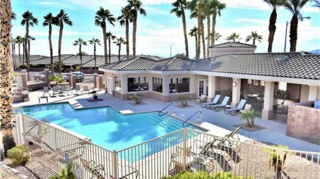 view of swimming pool featuring a patio area