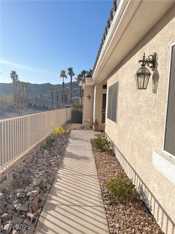 view of yard with a mountain view and central air condition unit