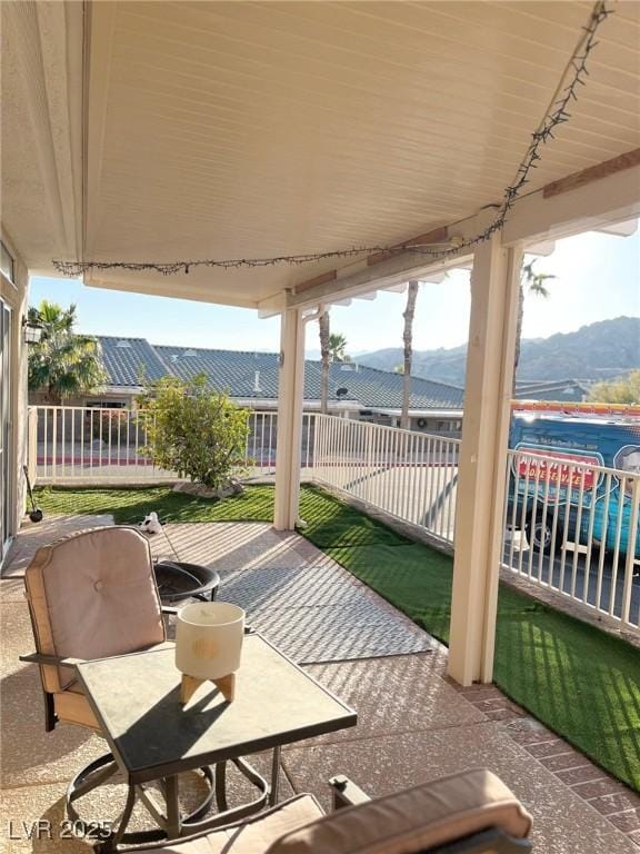 view of patio / terrace with a mountain view