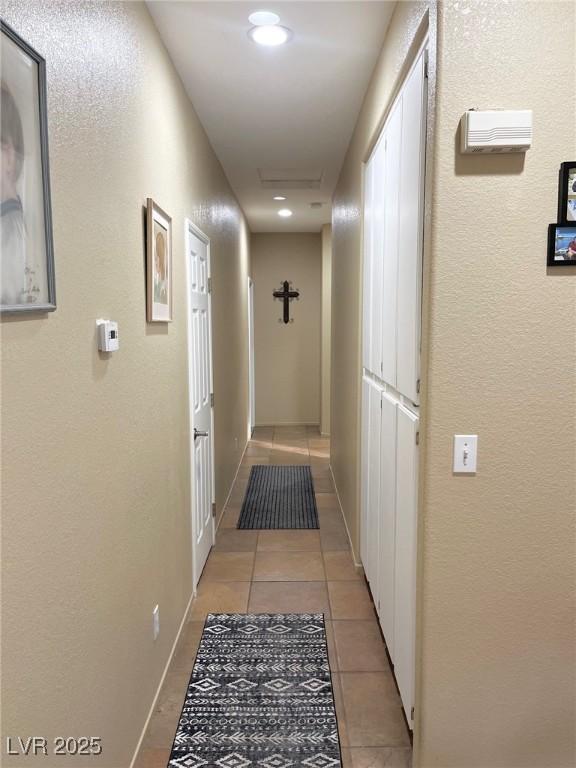 hallway featuring light tile patterned floors