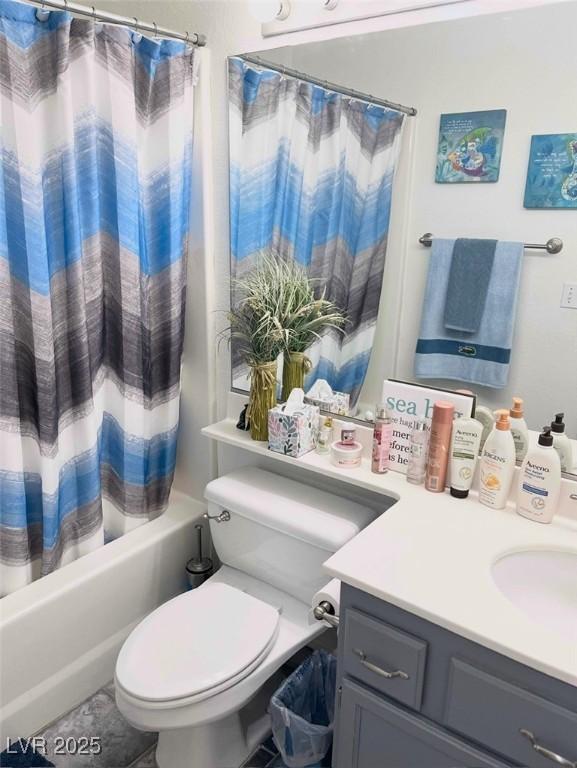 full bathroom featuring vanity, toilet, and shower / bath combo with shower curtain