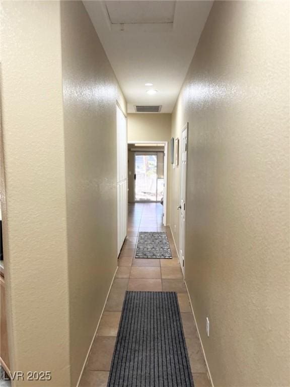 hallway with light tile patterned flooring