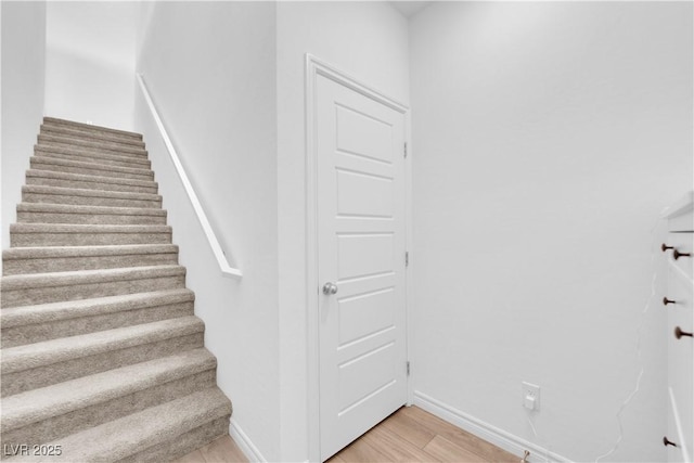 stairway featuring hardwood / wood-style floors