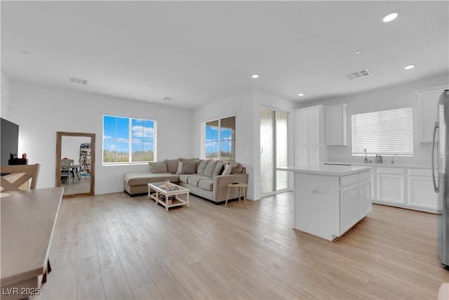 living room featuring light wood-type flooring