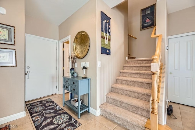 entryway with light tile patterned floors