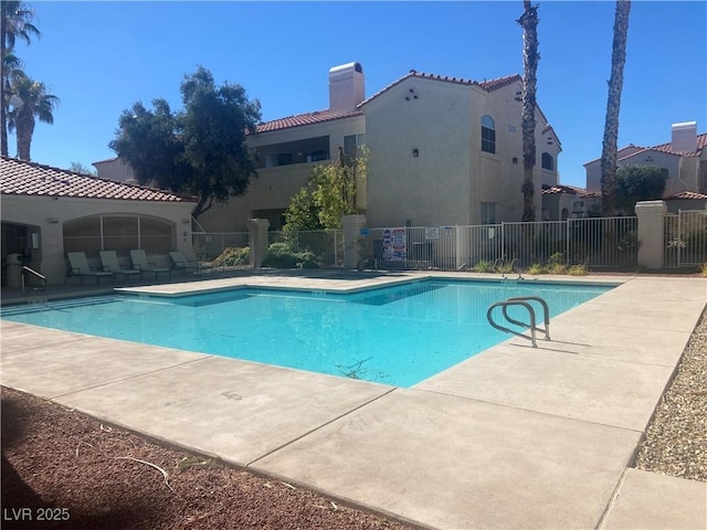 view of swimming pool with a patio