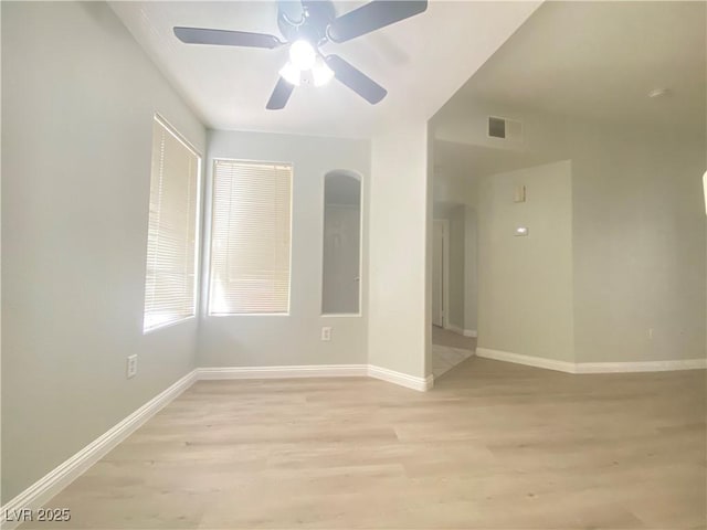 unfurnished room featuring ceiling fan and light hardwood / wood-style flooring