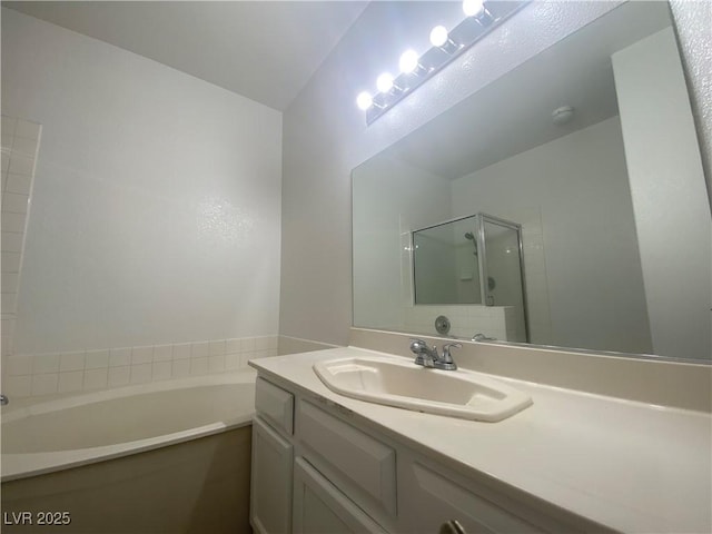 bathroom with vanity and independent shower and bath