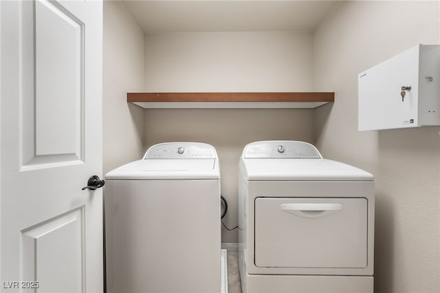 washroom with independent washer and dryer