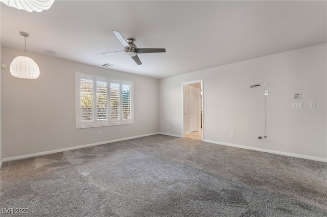 empty room with carpet flooring and ceiling fan