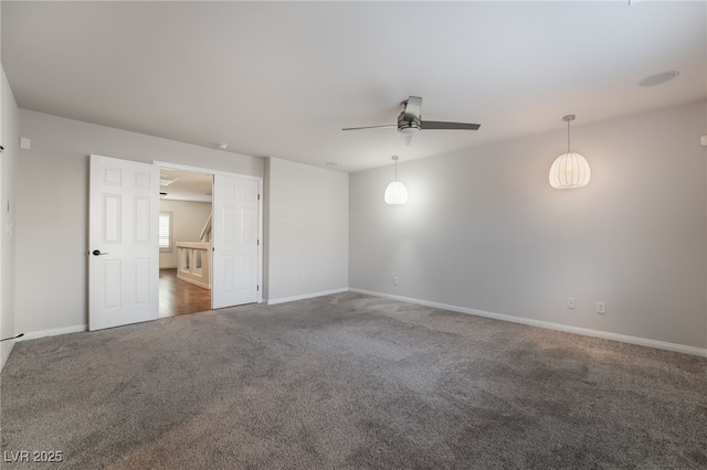 carpeted empty room with ceiling fan