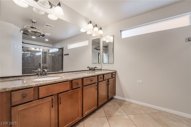 bathroom with tile patterned floors, vanity, and a shower with shower door