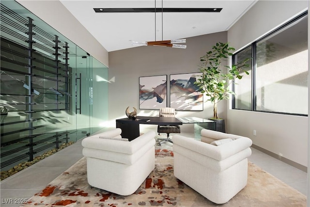 living room featuring ceiling fan and lofted ceiling