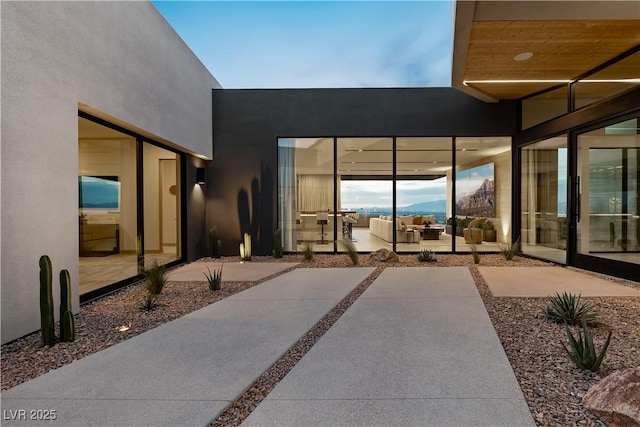 entrance to property featuring a patio