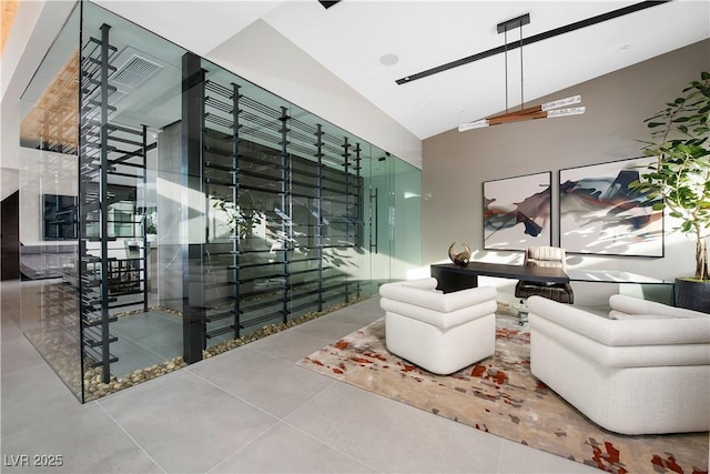 wine area with tile patterned flooring and vaulted ceiling