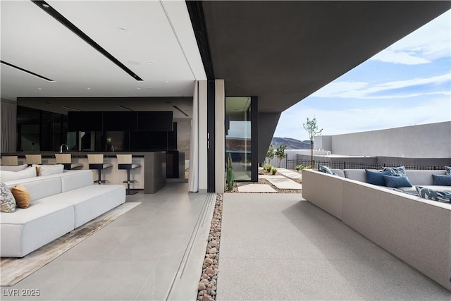 balcony with a patio area and an outdoor living space