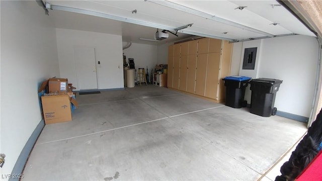 garage featuring a garage door opener and electric panel