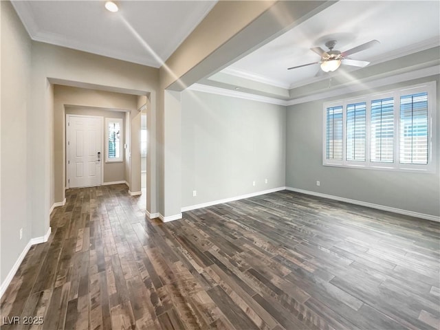 unfurnished room with ceiling fan, dark wood-type flooring, and ornamental molding