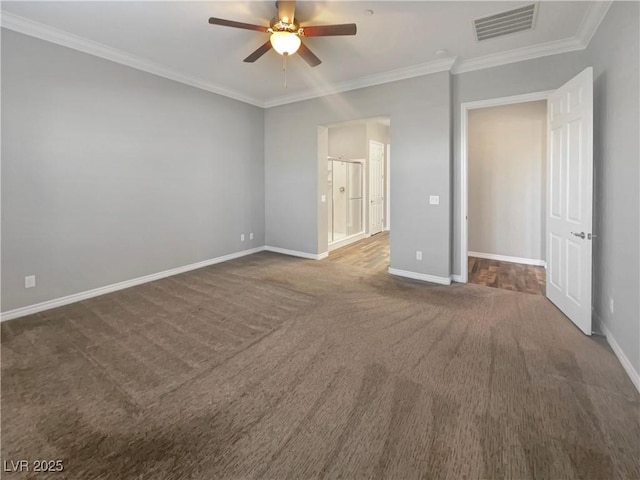 unfurnished bedroom with dark colored carpet, ceiling fan, and ornamental molding