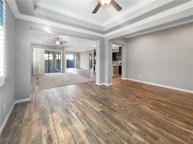 unfurnished living room with dark hardwood / wood-style floors, ceiling fan, and crown molding