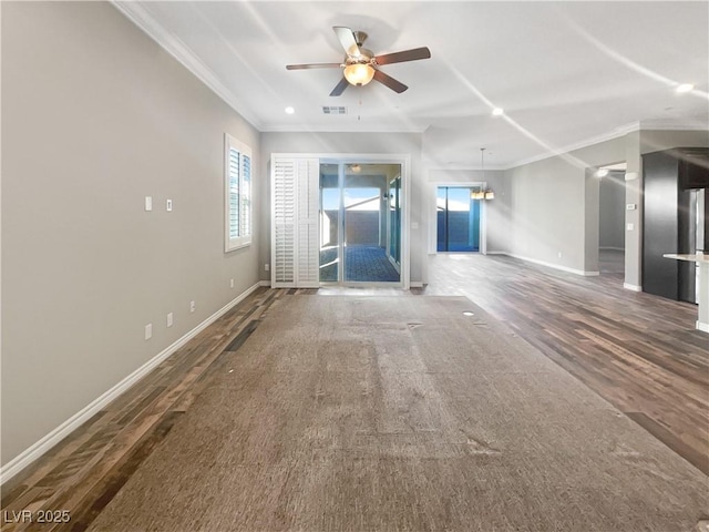 unfurnished living room featuring ceiling fan, crown molding, and dark wood-type flooring