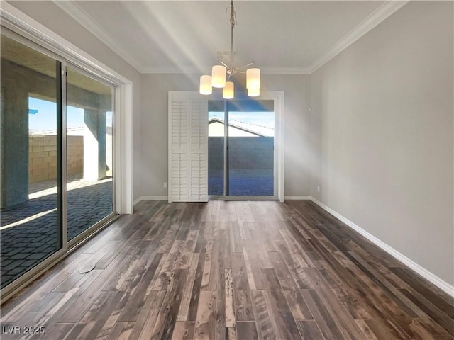 unfurnished dining area with ornamental molding, dark wood-type flooring, and a chandelier