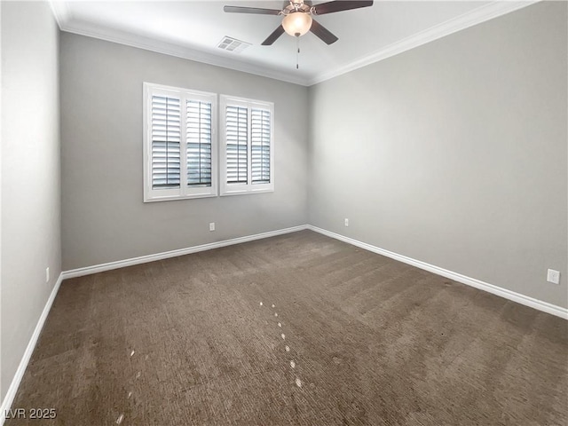 spare room with dark colored carpet, ceiling fan, and crown molding